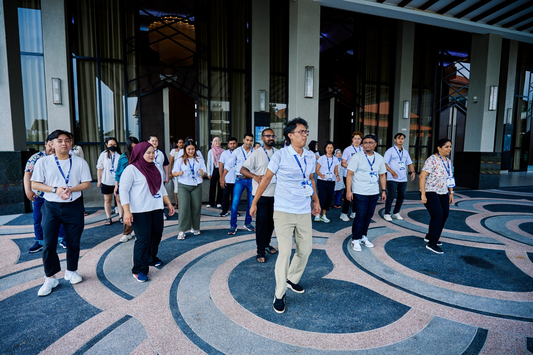 Group walking activity at hotel entrance