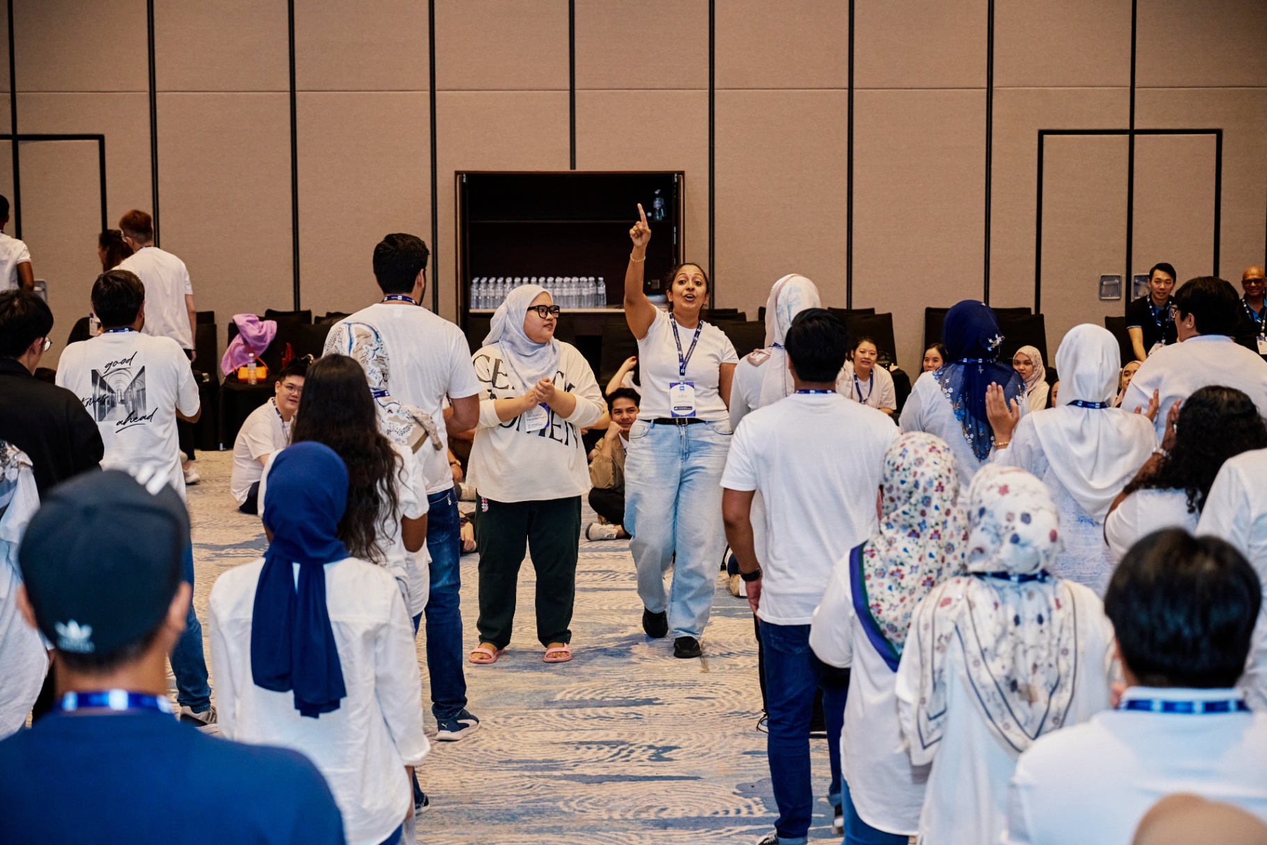 Facilitators leading a large group circle