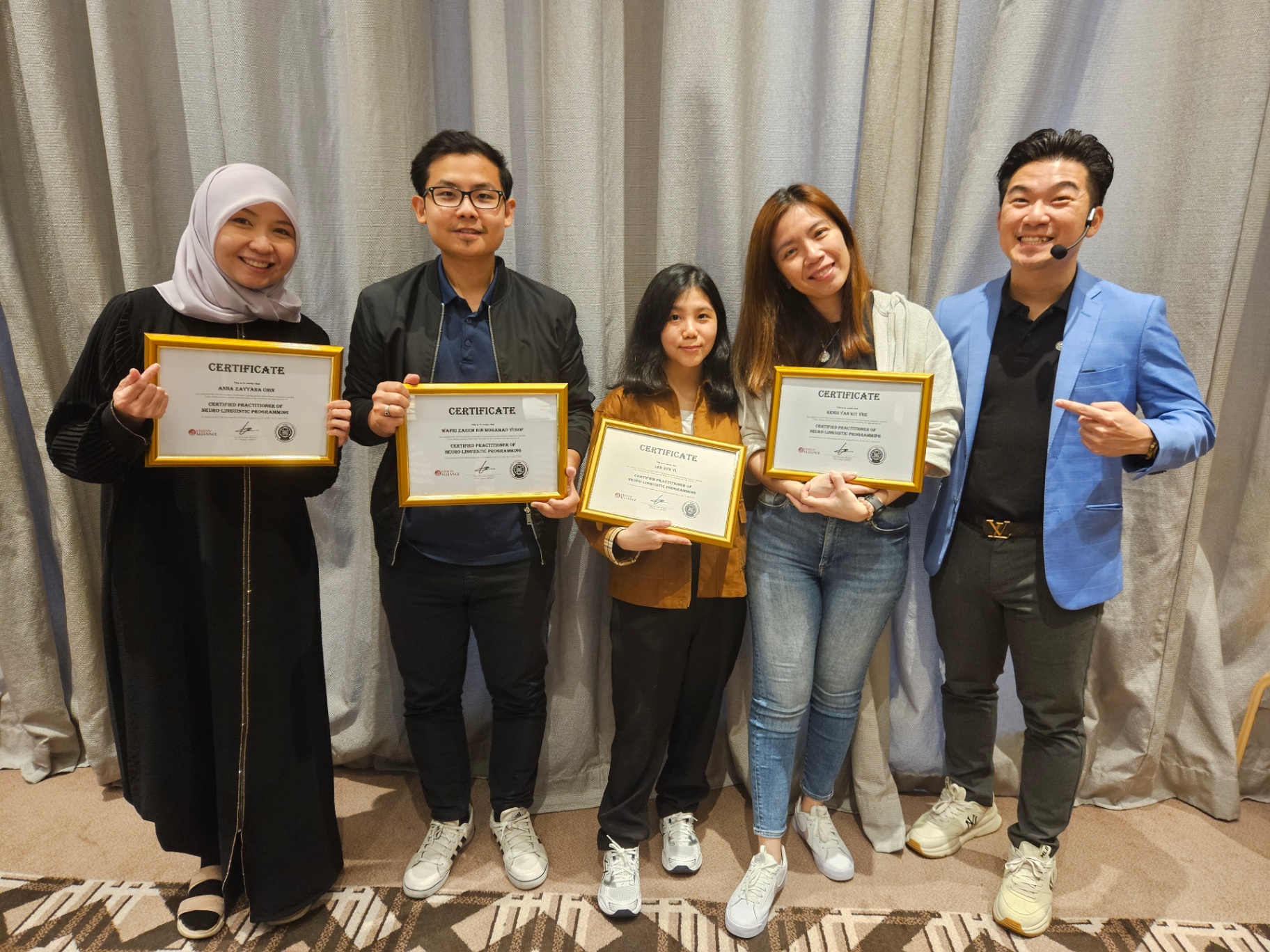 NLP certification graduates with certificates
